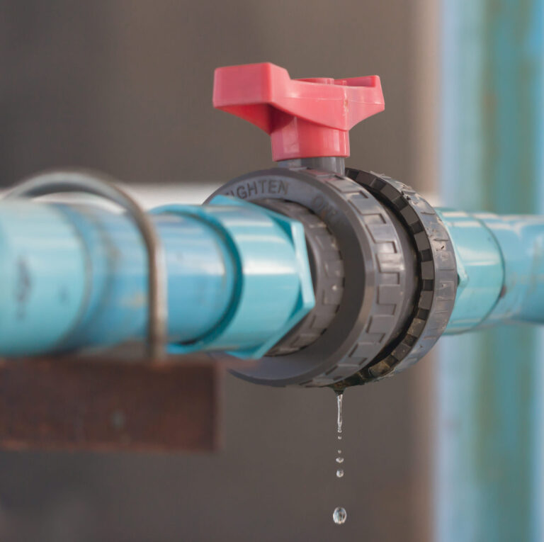 leaking water from blue pipe and red valve