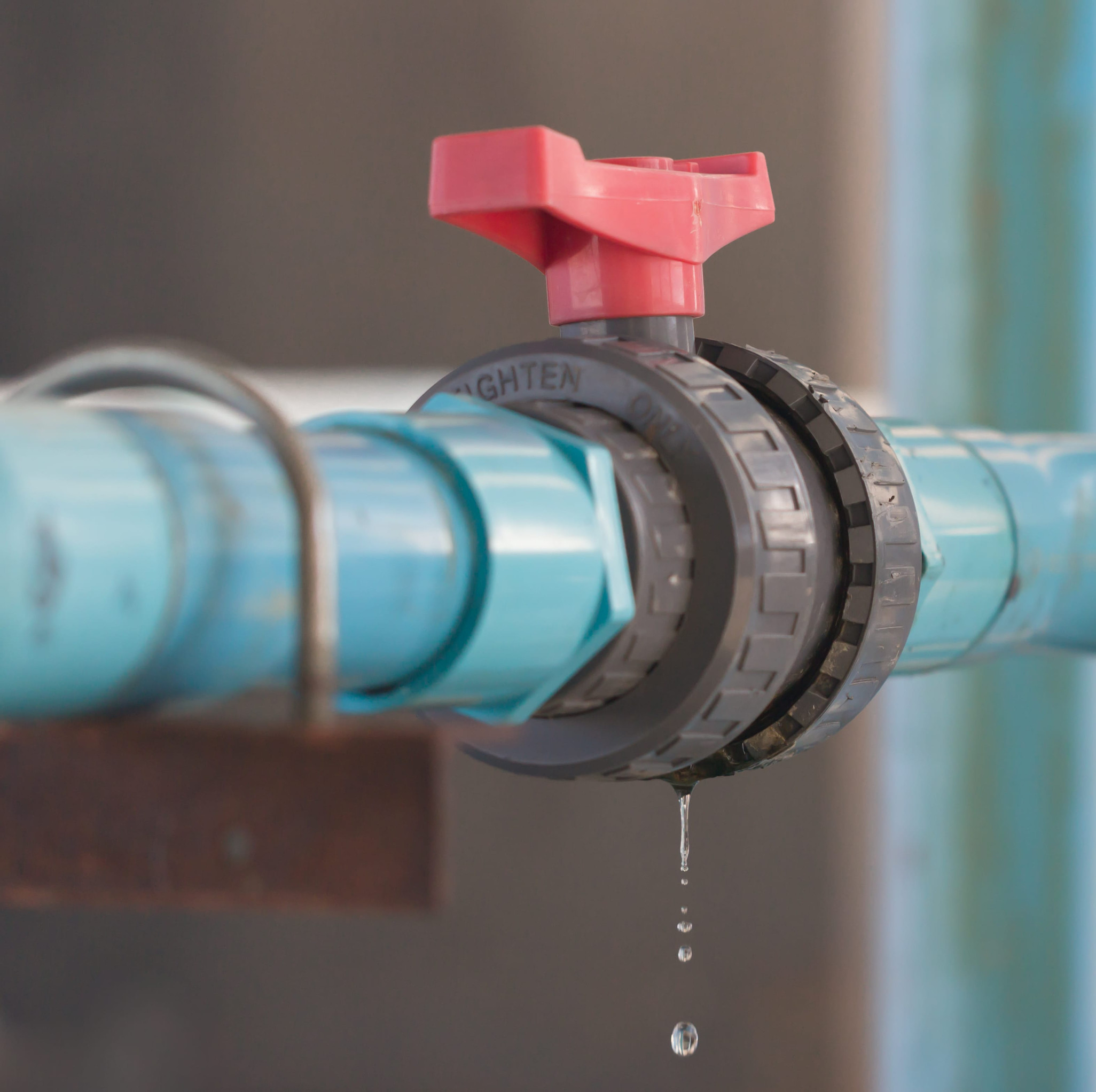 leaking water from blue pipe and red valve