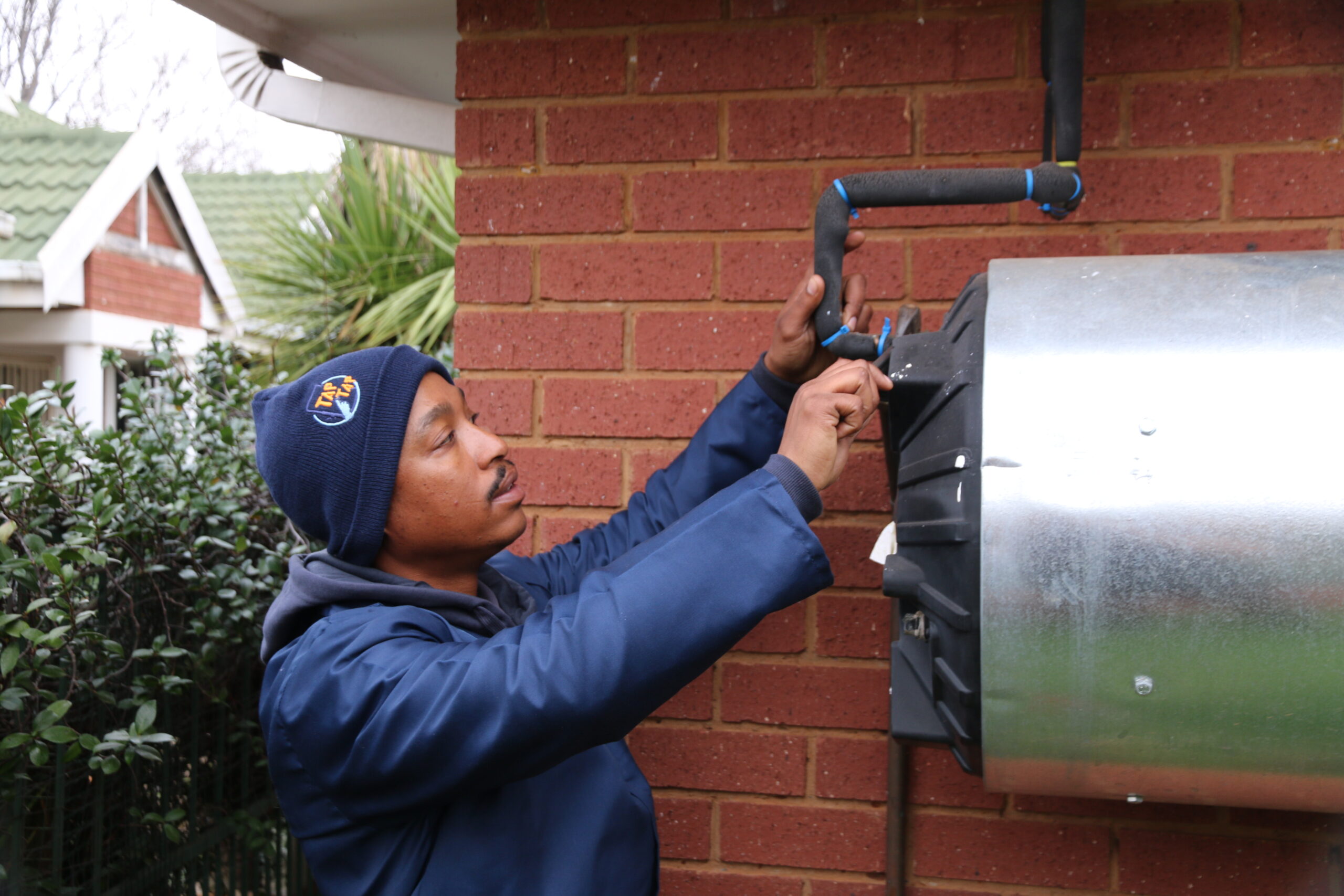 Tap Tap Plumbing technician carrying out geyser repairs at a residential property in Potchefstroom