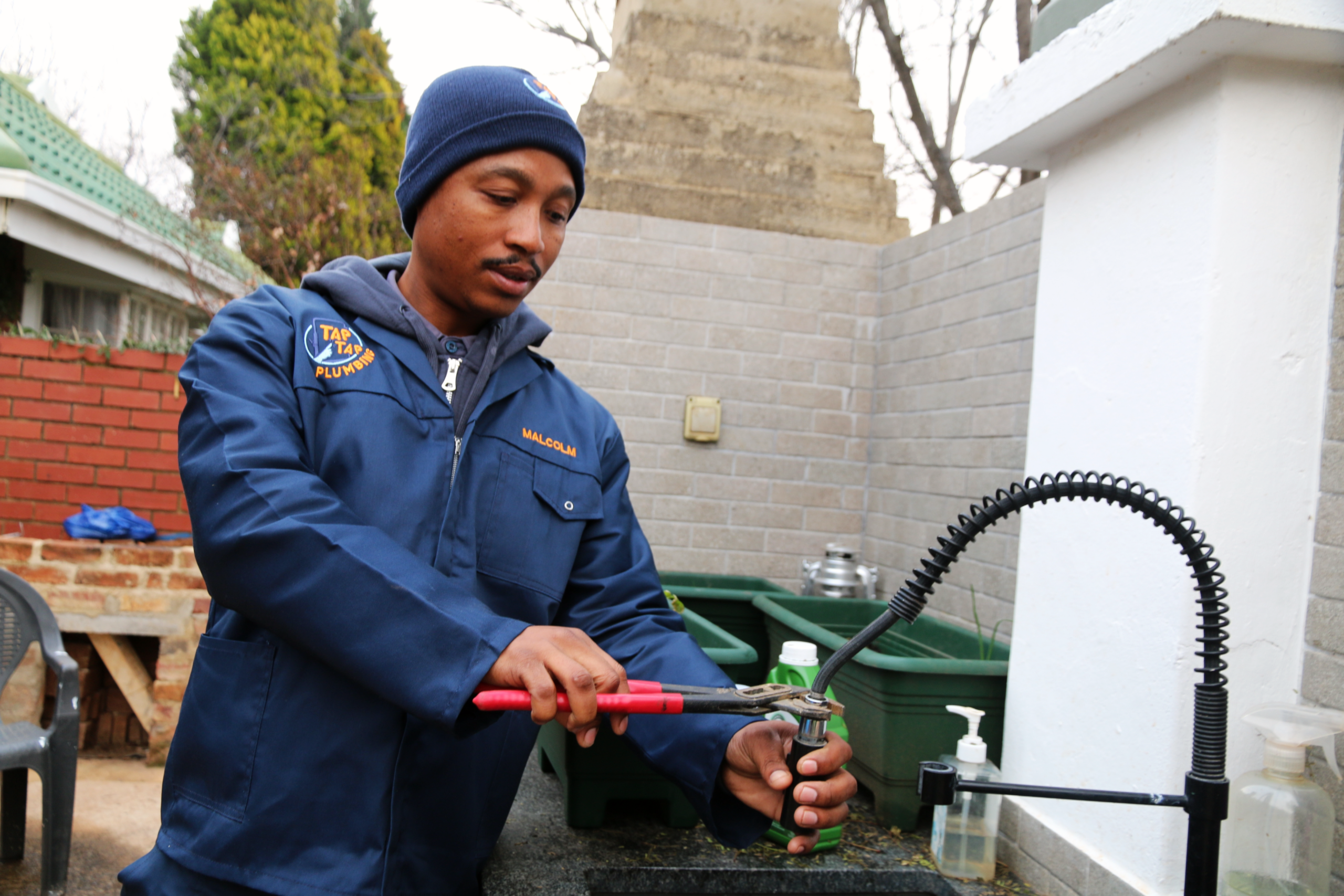 Tap Tap Plumbing technician inspecting and diagnosing a plumbing issue at a residential property in Potchefstroom